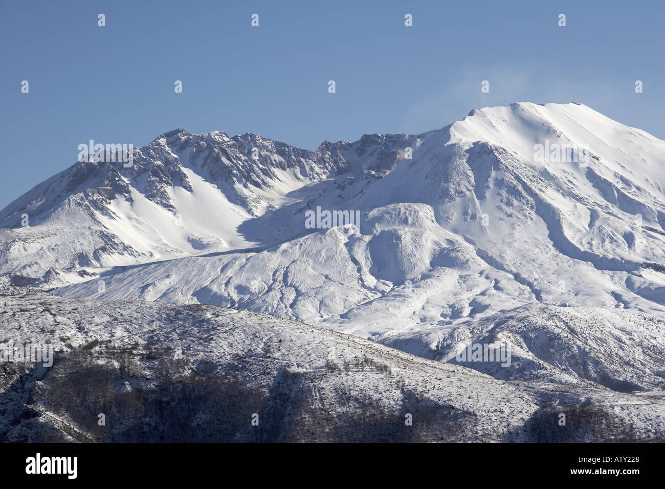 Wisps of steam rise from volcano crater of Mount St Helens winter view ...