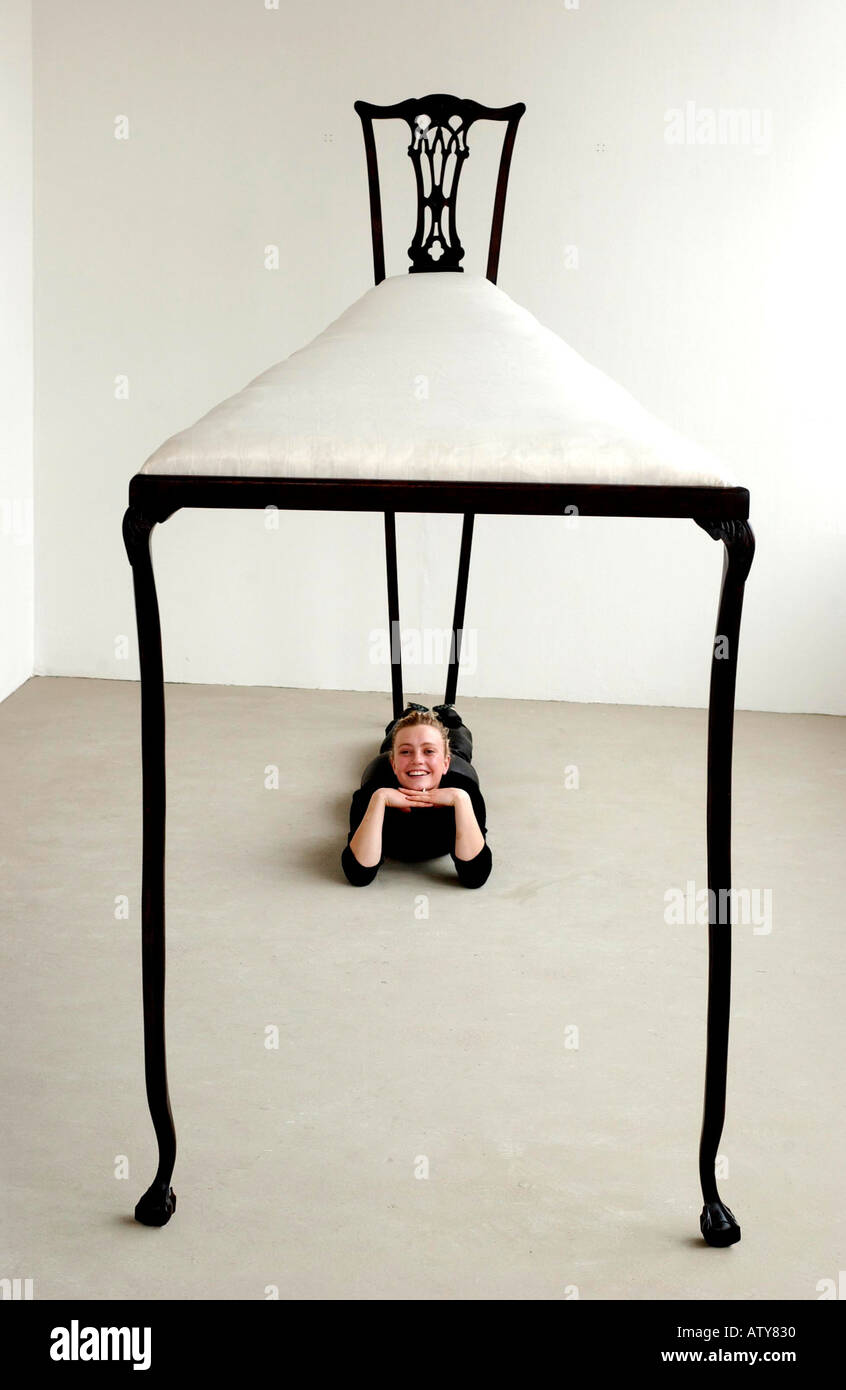 New perspective Artist creates enormous chair Stock Photo