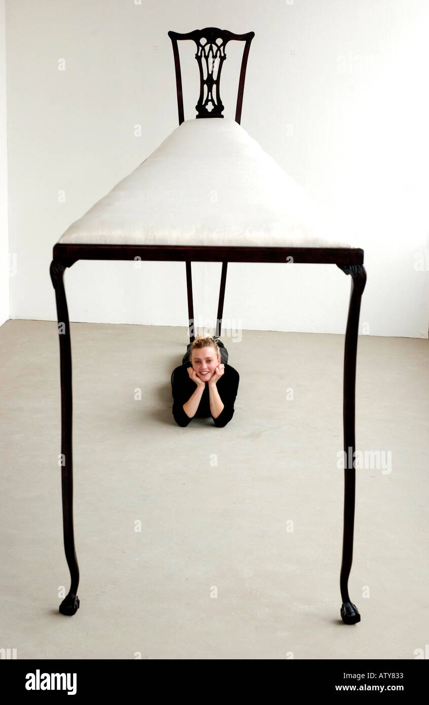 New perspective on furniture as young artist creates a larger than life enormous chair Stock Photo