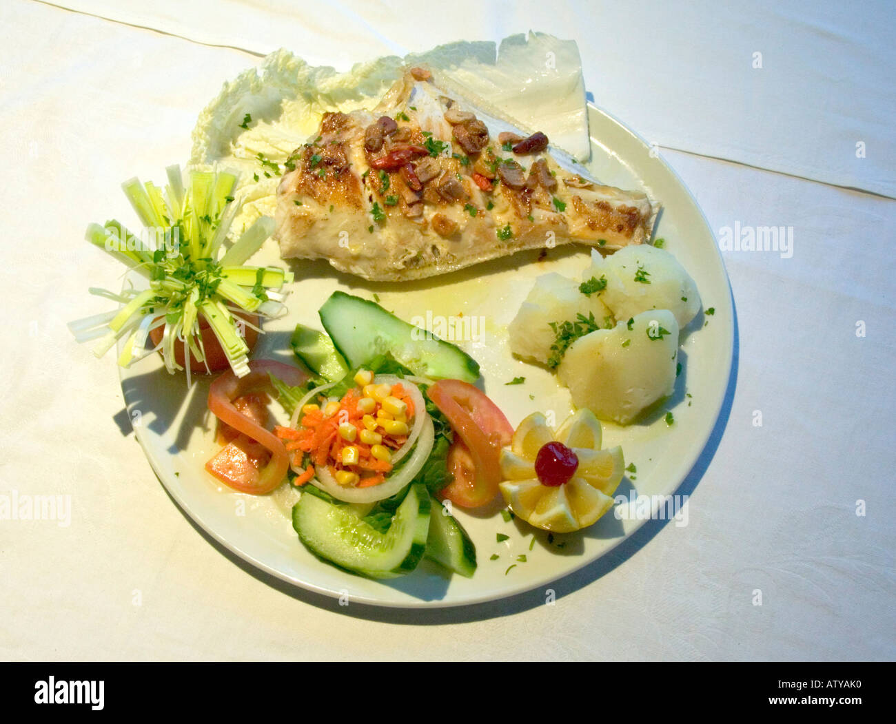 Traditional meal Gallo Moruno fish boiled potatoes and salad Waikiki
