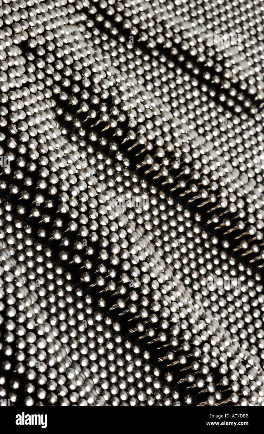 Pin Matrix with hand imprint Stock Photo