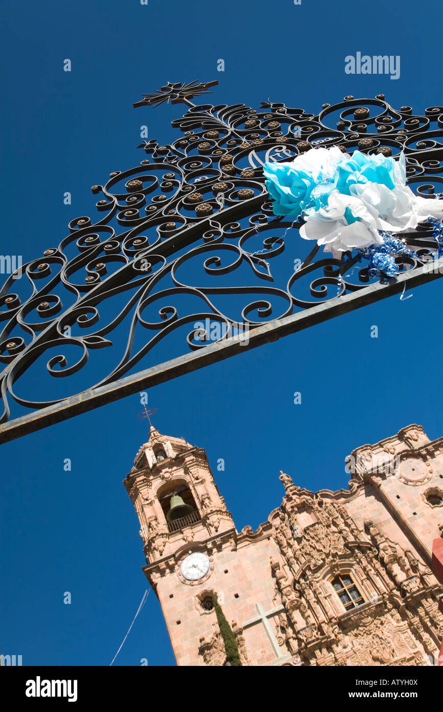 MEXICO Valenciana Front of Church of San Cayetano churrigueresque style iron gate paper flower built 1700s single tower Stock Photo