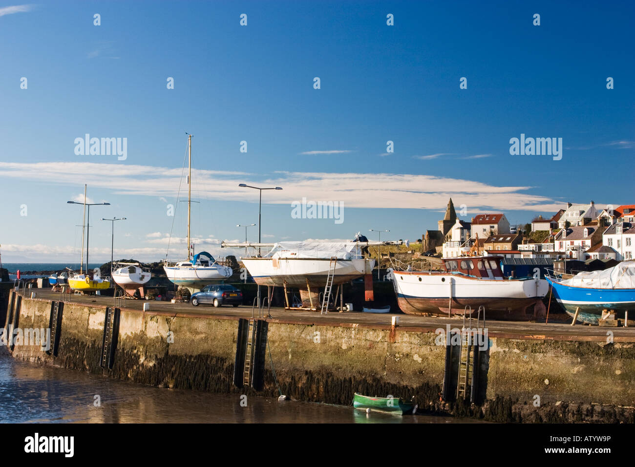 Boats out of water over winter in St Monans harbour, Fife, Scotland Stock Photo