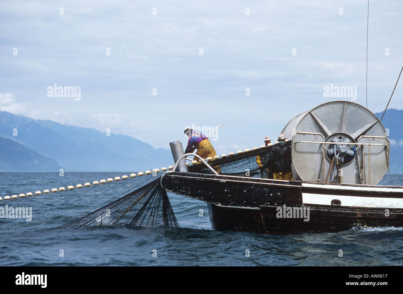 Canada BC Nass River Seine Boat crew retrieving nets Stock Photo