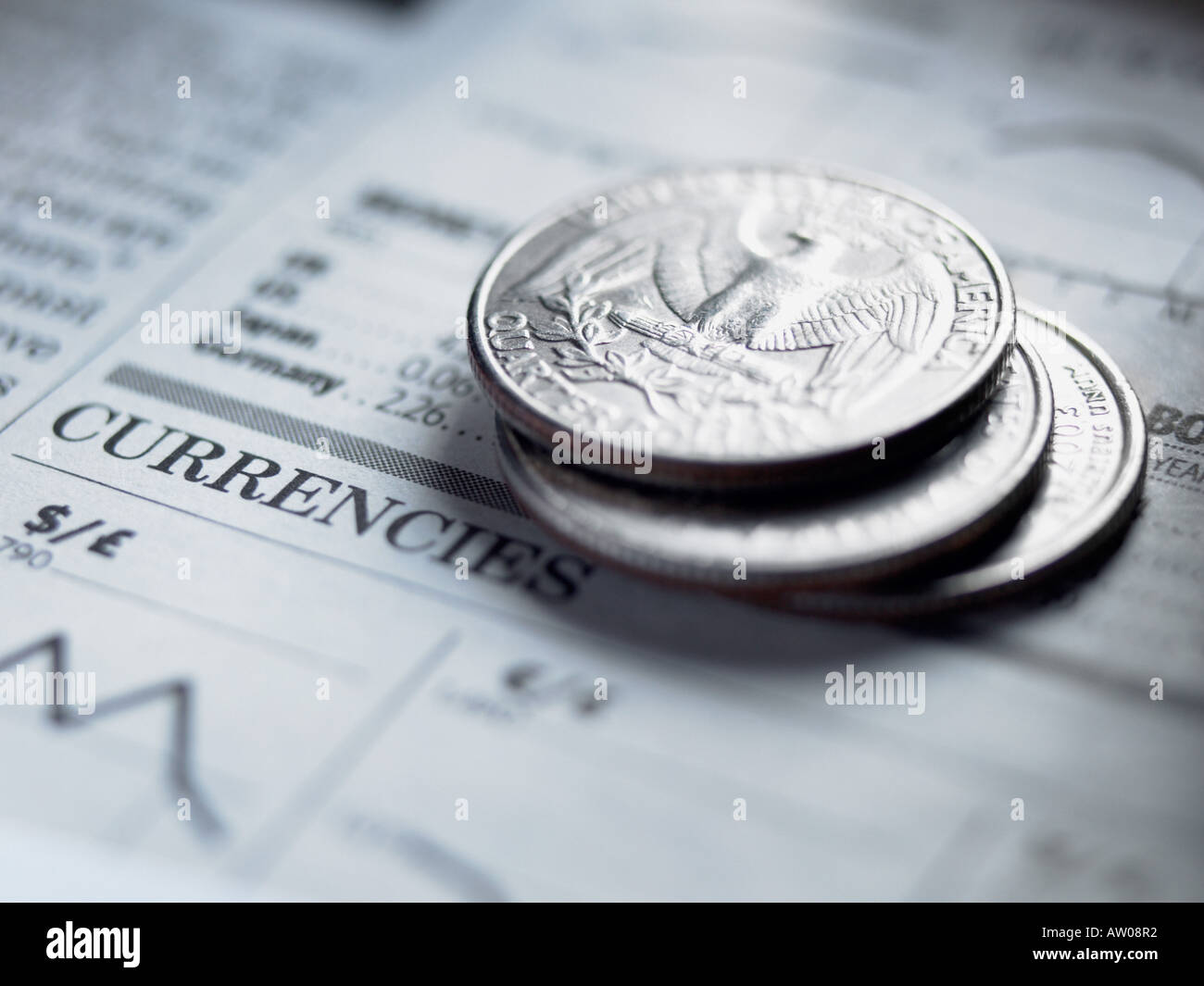 Quarters on a newspaper Stock Photo