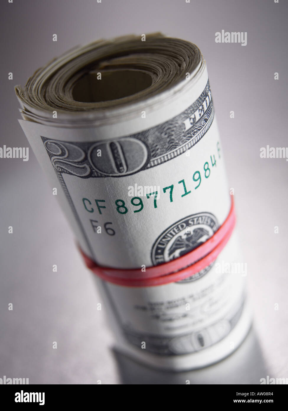 Banknotes rolled in a rubber band Stock Photo Alamy