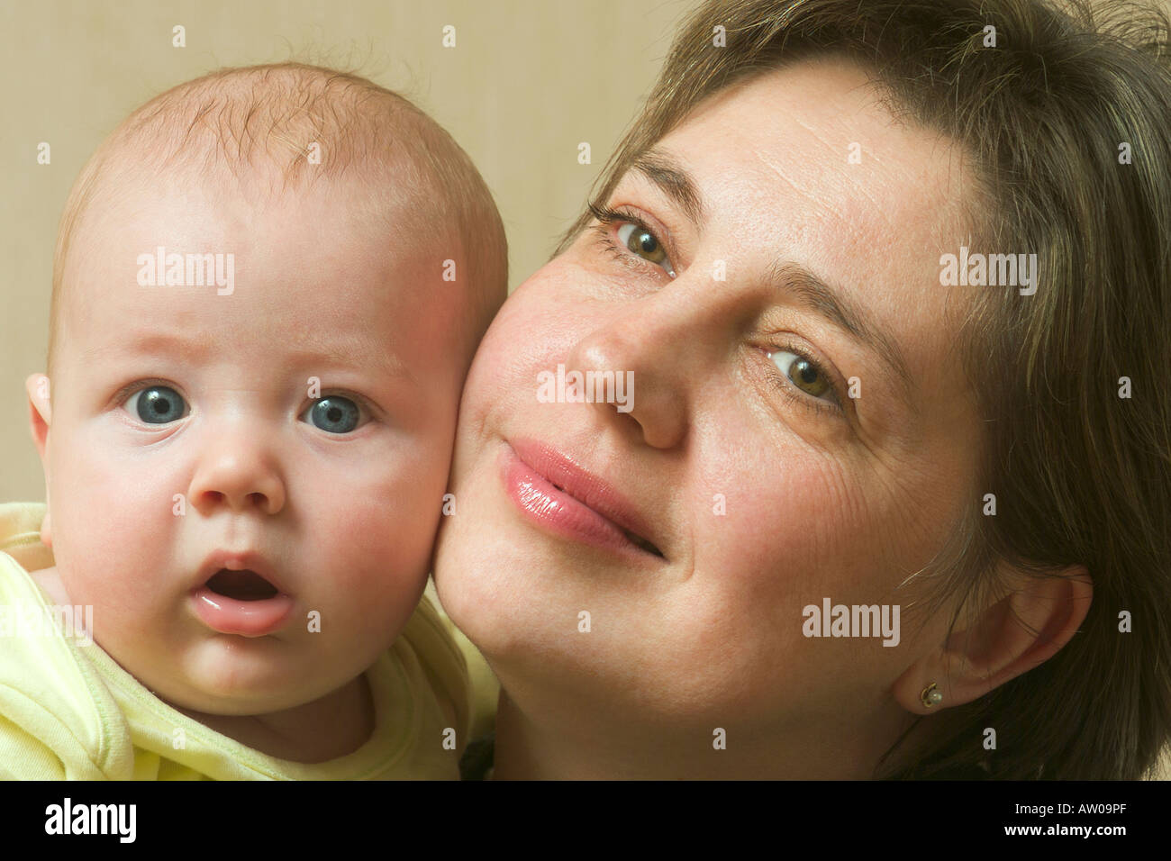 mother cheek to cheek with her little baby Stock Photo - Alamy