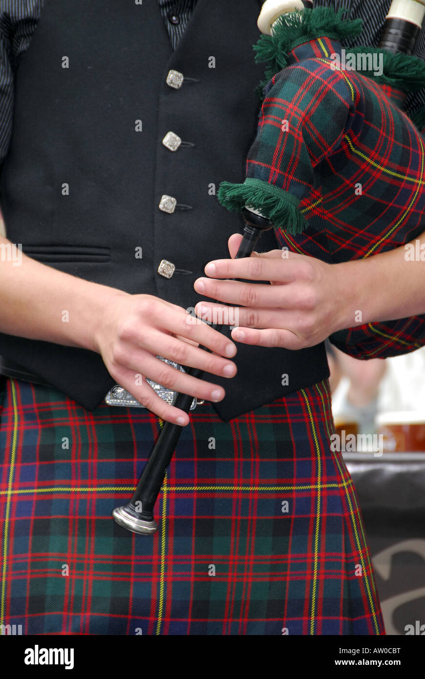 Close up shot of man playing Scottish bagpipes Stock Photo