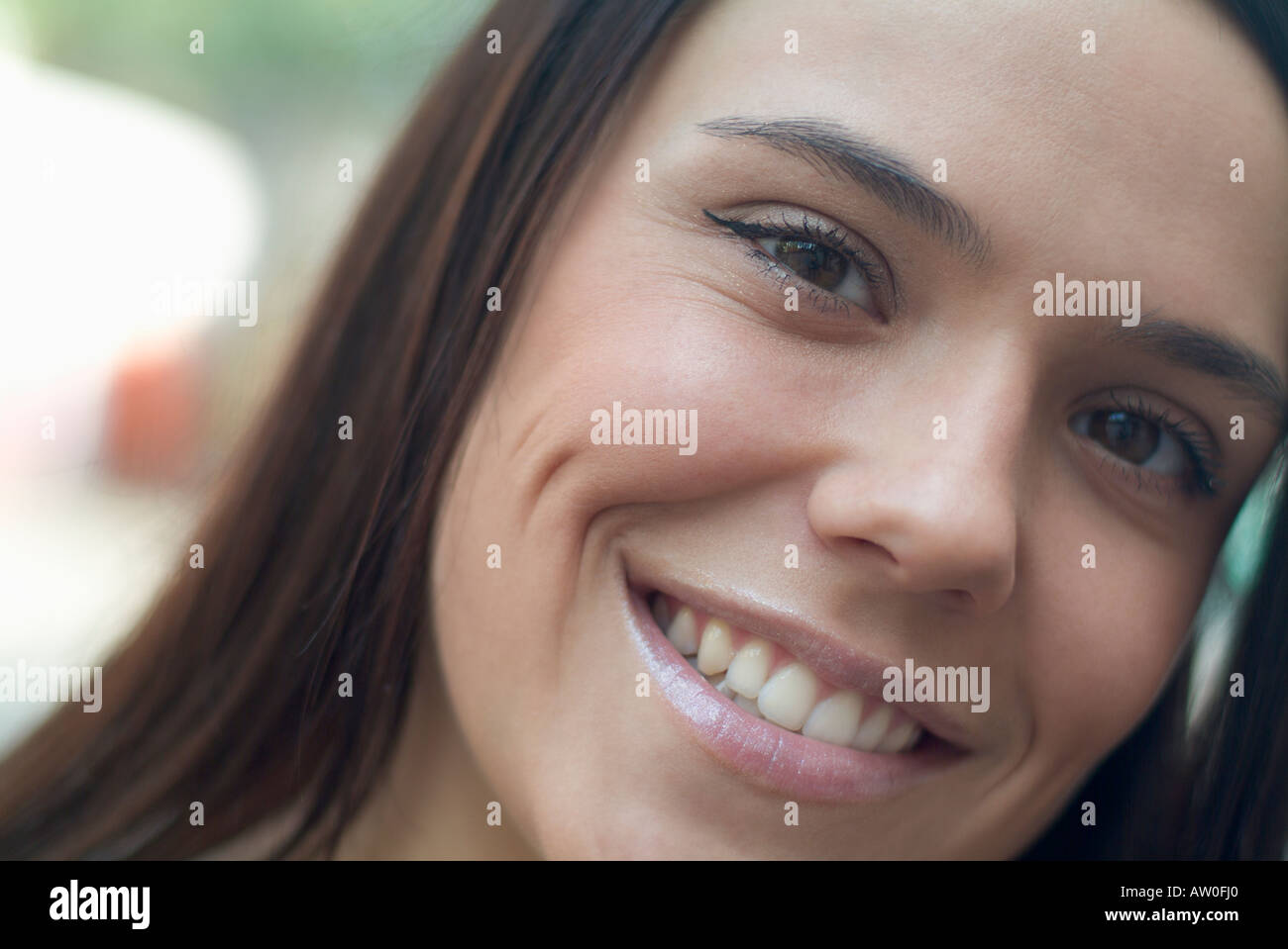 portrait of smiling woman with long brown hair Stock Photo - Alamy