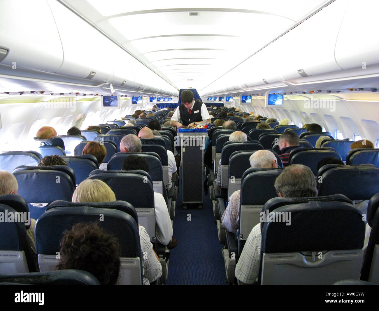 Passengers on a aeroplane Stock Photo