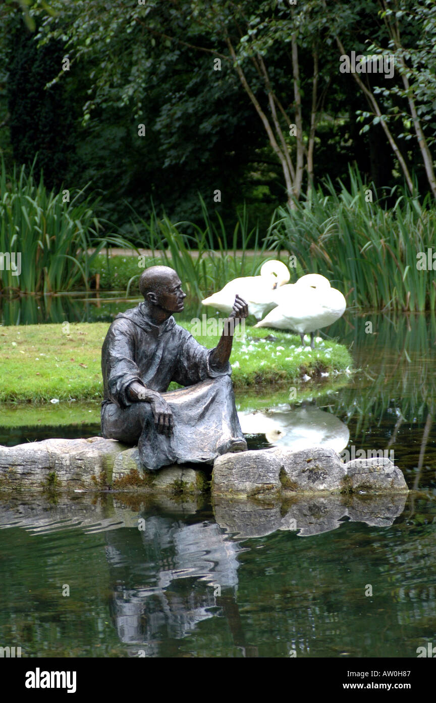 IRL  Bronze figure of St Fiacre by a pond in a garden which bears his name close to Irelands National Stud -Kildare Ireland Stock Photo