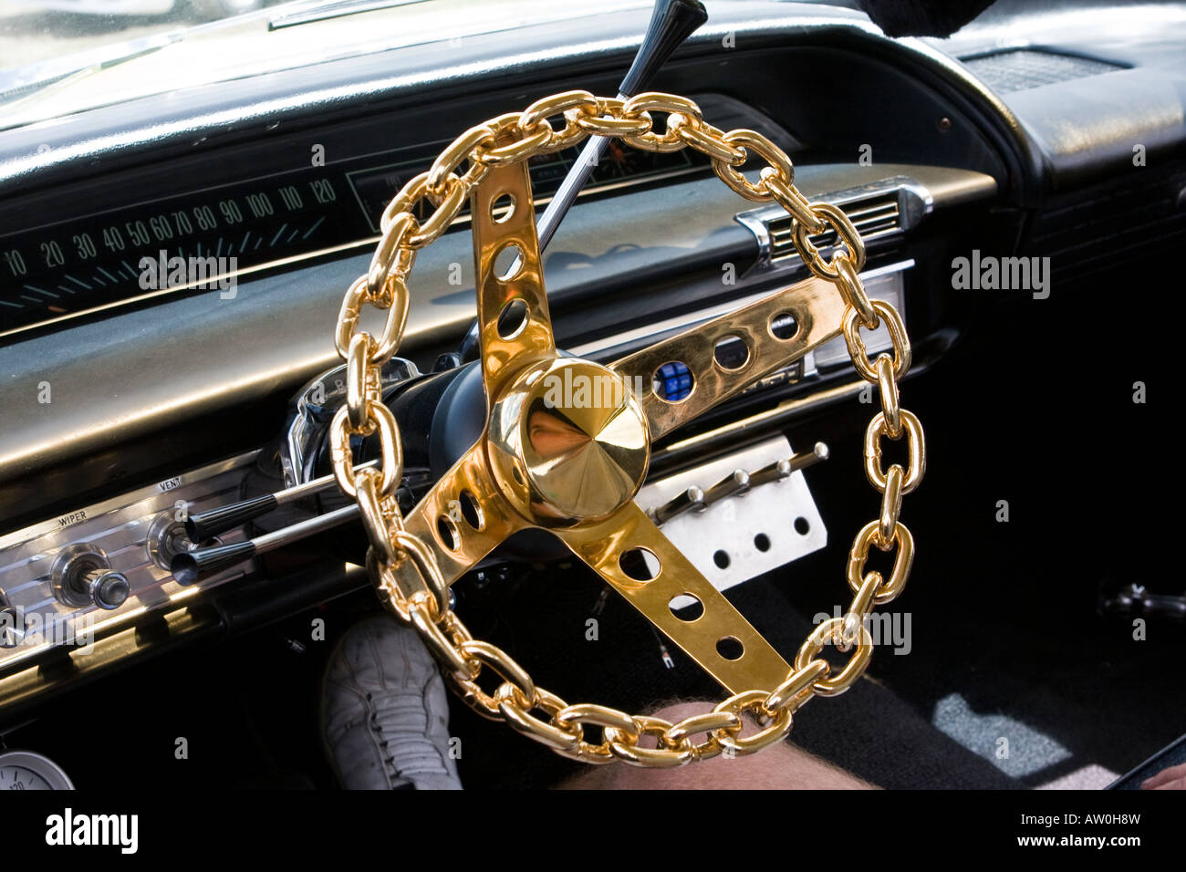 Steering wheel made of gold plated chain Stock Photo