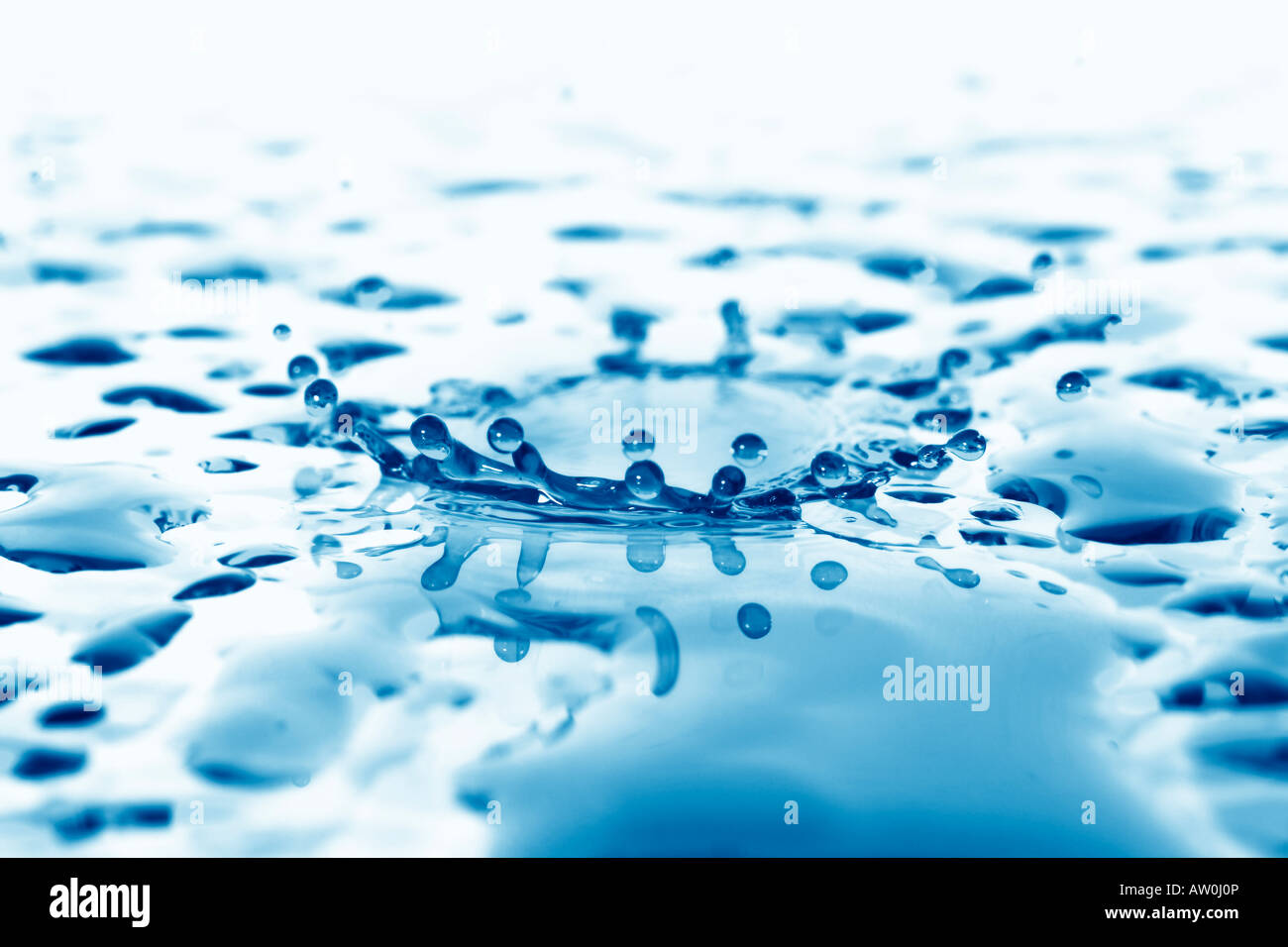 water droplet rebounding on the surface Stock Photo Alamy