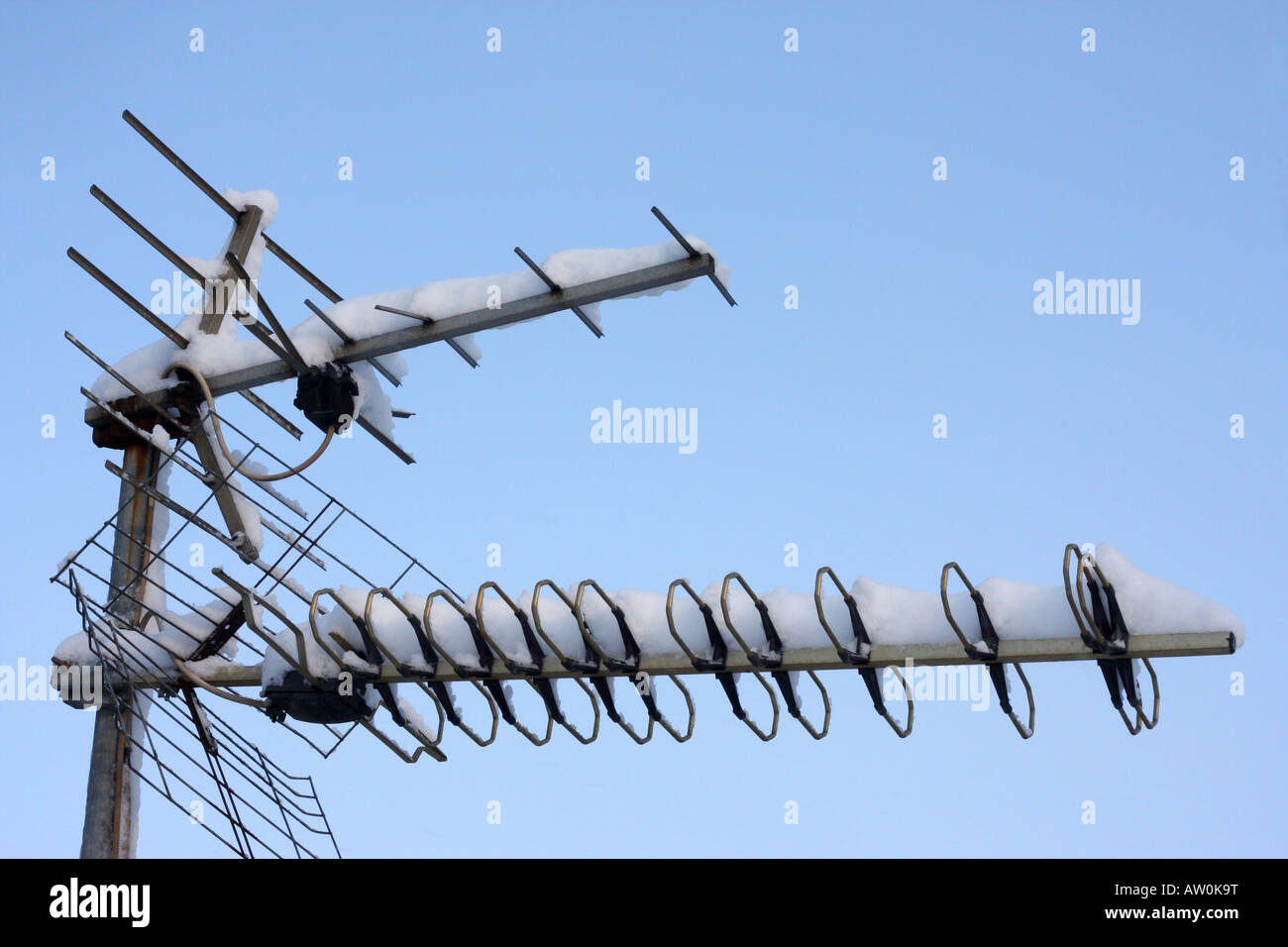 TV antenna covered with snow Stock Photo