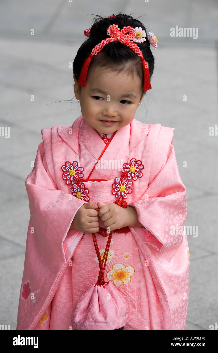 Tiny tot in pink kimono- Meiji Shrine Tokyo 1 Stock Photo