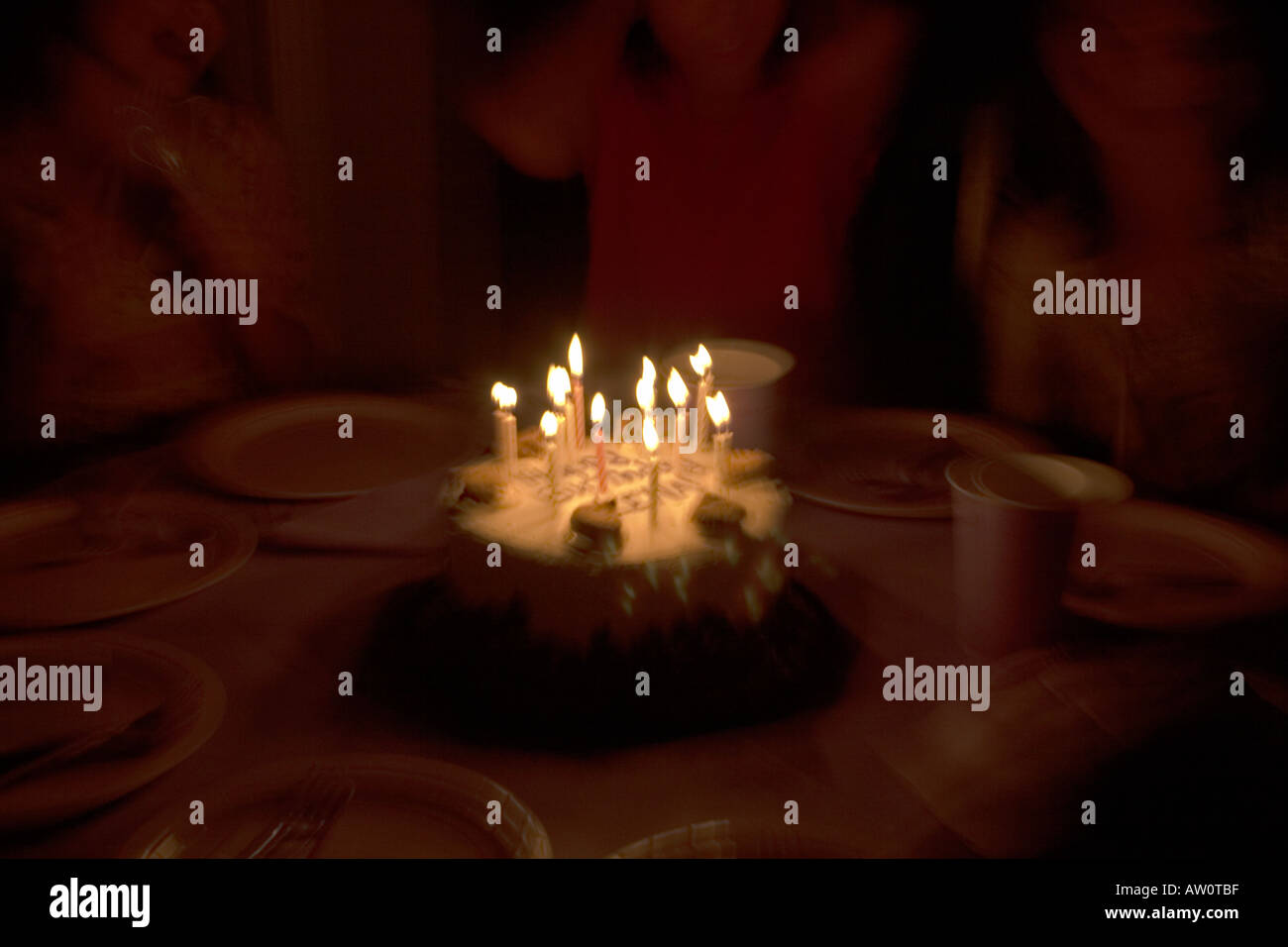 Birthday cake with lit candles Stock Photo - Alamy