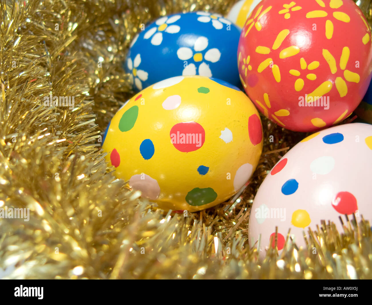 Real hand painted Easter eggs in a golden nest Stock Photo - Alamy