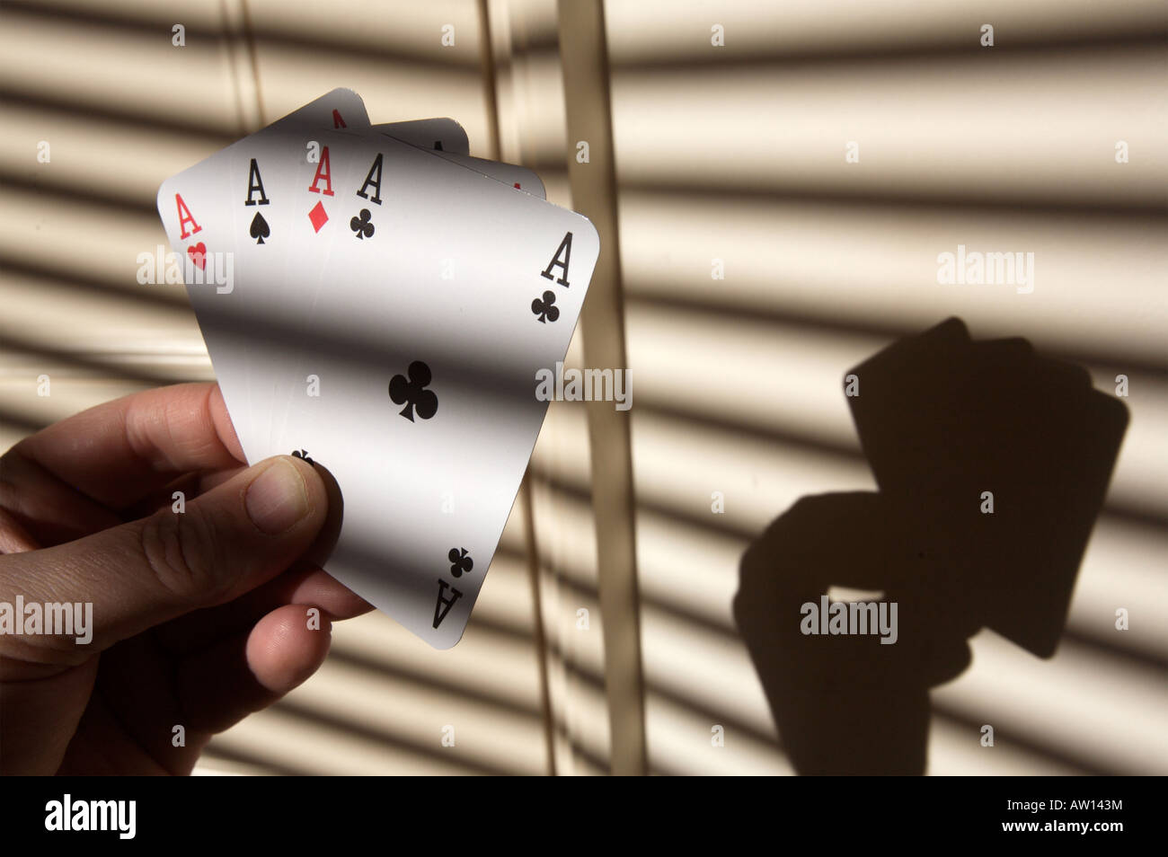 A hand of four aces Stock Photo