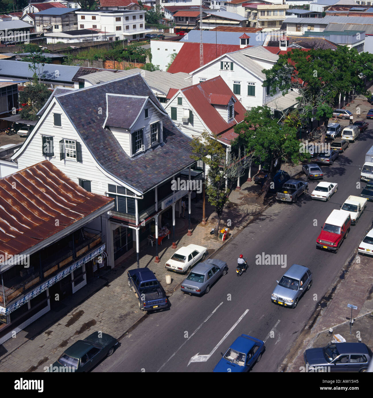 A street view of Dominee Straat with traditional style wood and colonial buildings in Paramaribo Suriname South America Stock Photo