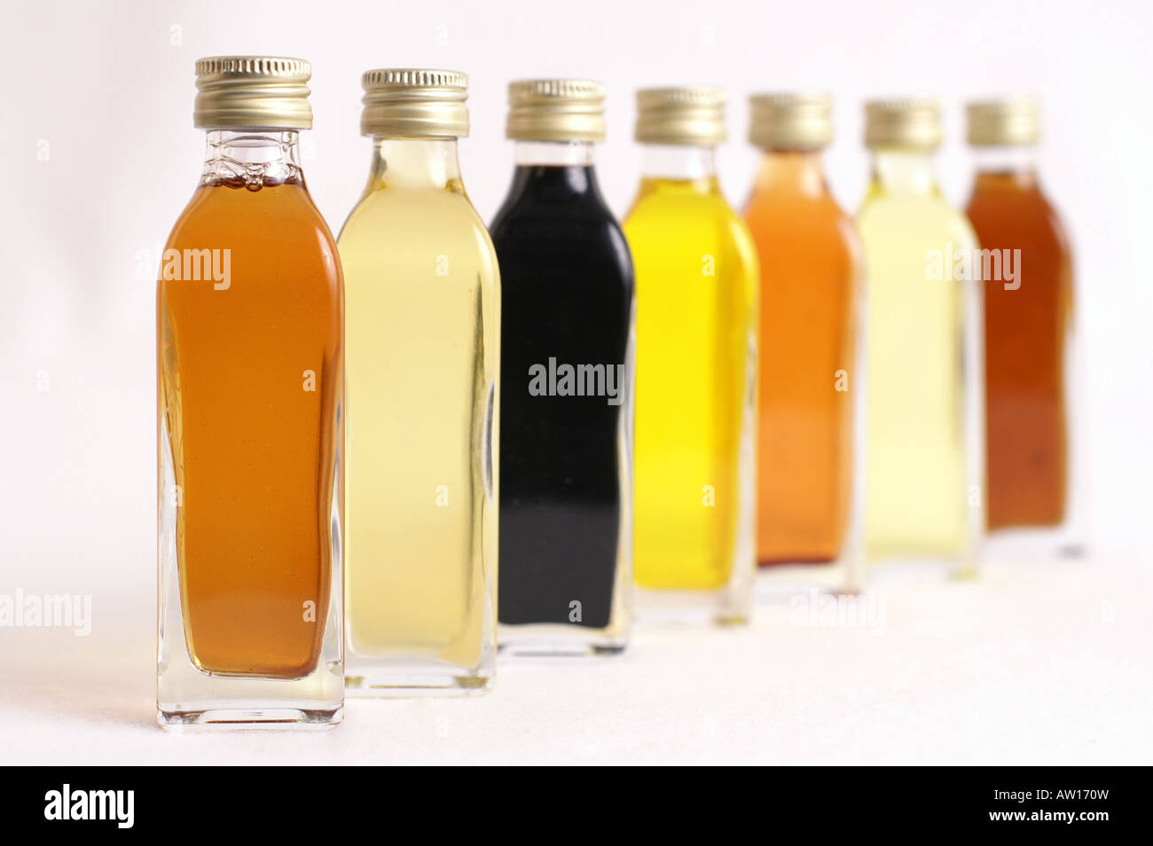 Several bottles of olive oil and vinegar Stock Photo