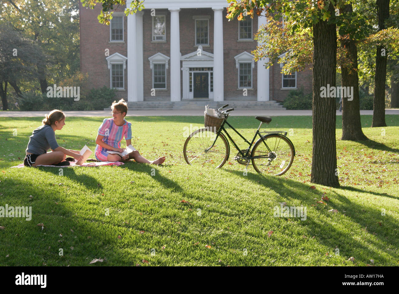 Wisconsin,WI,Rock County,Beloit,Beloit College,school,campus,Middle College,school,campus,student students pupil sit on Indian mound,grass,bicycle,bic Stock Photo