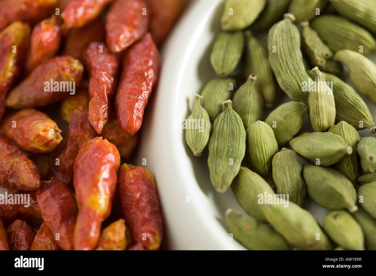 Dried kardamom seeds and chili Stock Photo