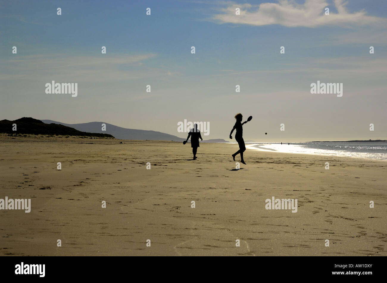Ball games on large beach action Isle of Harris Scotland Stock Photo