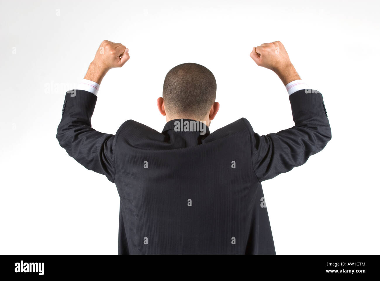 Rare view of a happy business man raising arms Stock Photo - Alamy
