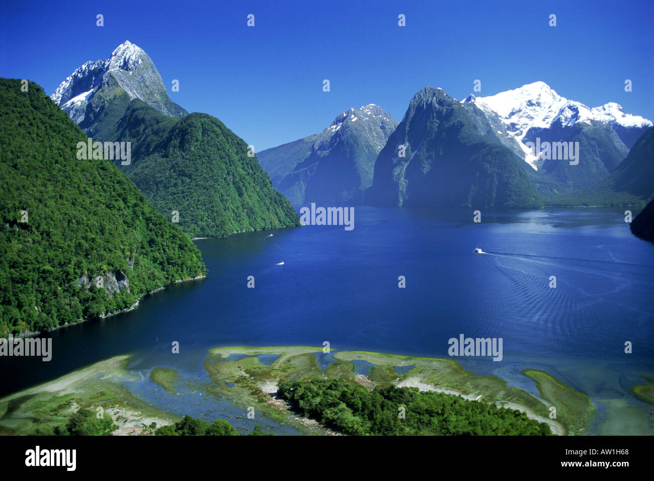 The Lion Peak above Milford Sound with ferryboats in Fjordland National