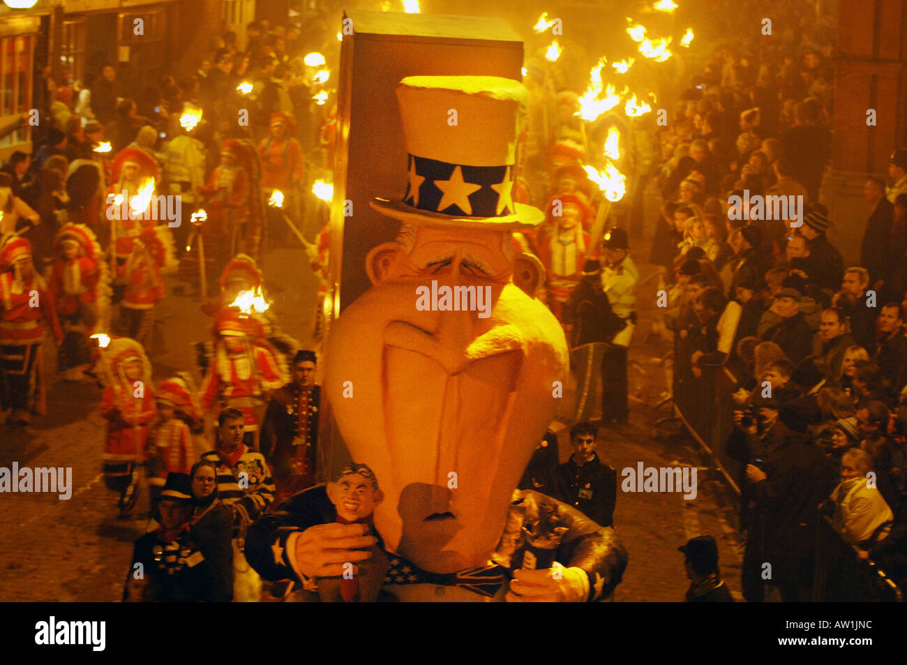 An effigy of George Bush holding a Tony Blair puppet on an anti Iraq war float in  the Lewes Bonfire Parade. Stock Photo