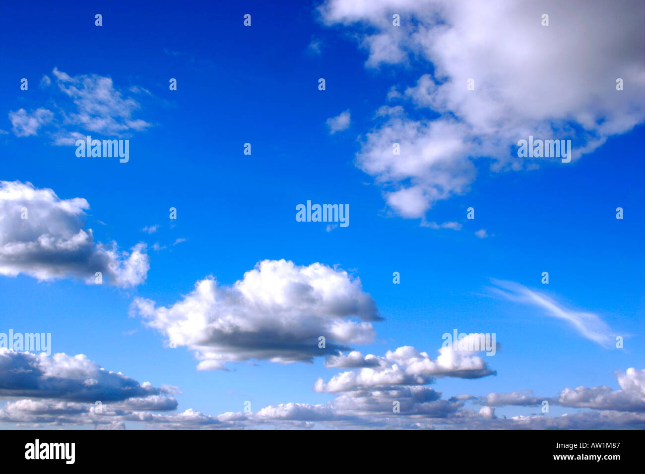 Blue sky with fluffy clouds Stock Photo - Alamy