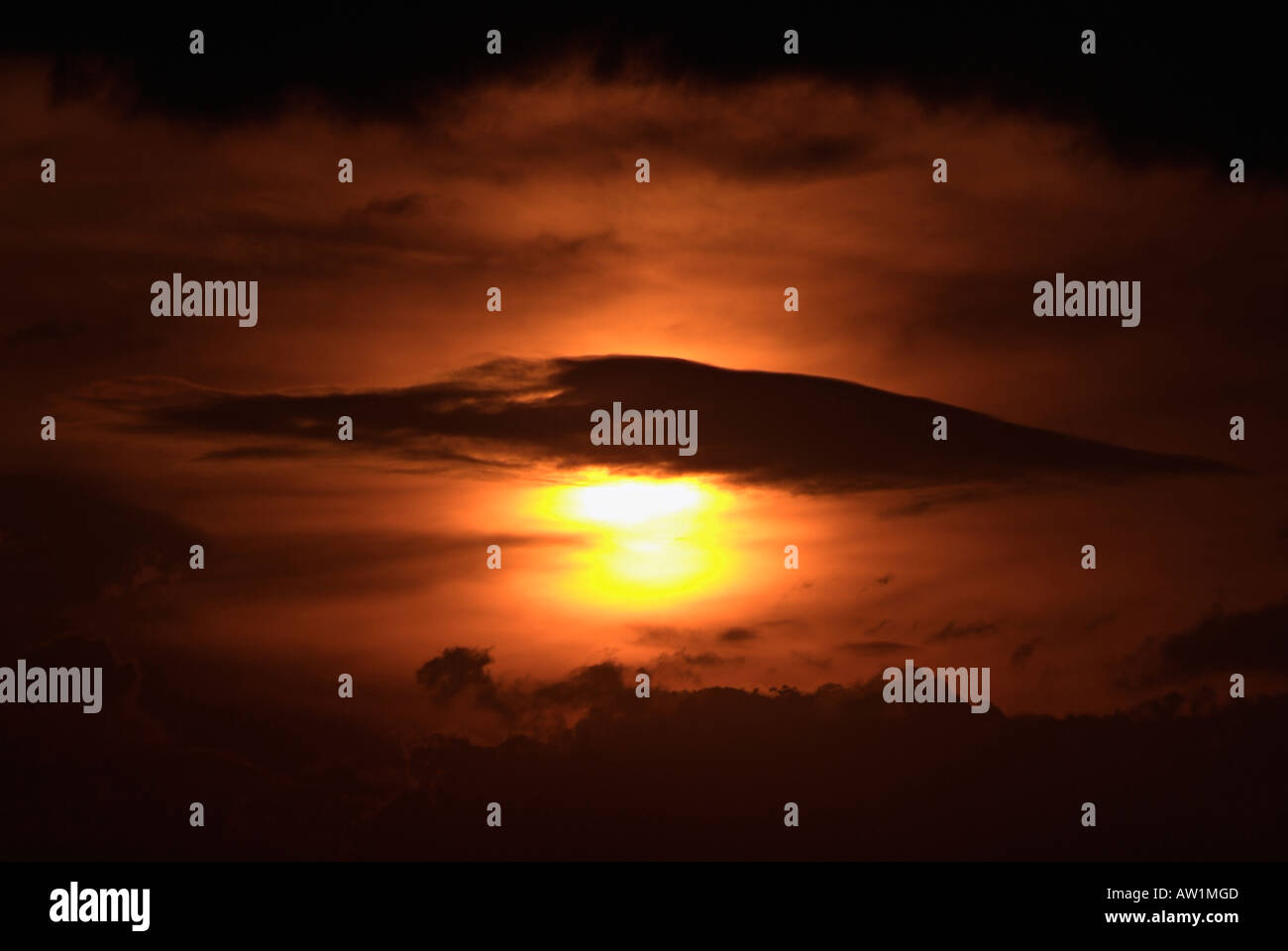 Sunset in a Dark Cloudy Sky Stock Photo