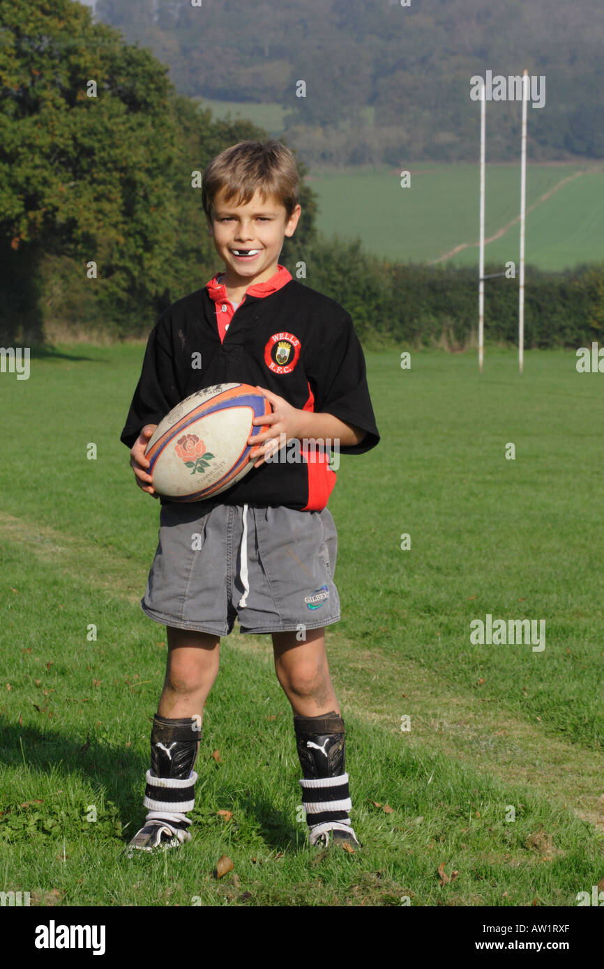 Young boy rugby player holding rugby ball Stock Photo Alamy