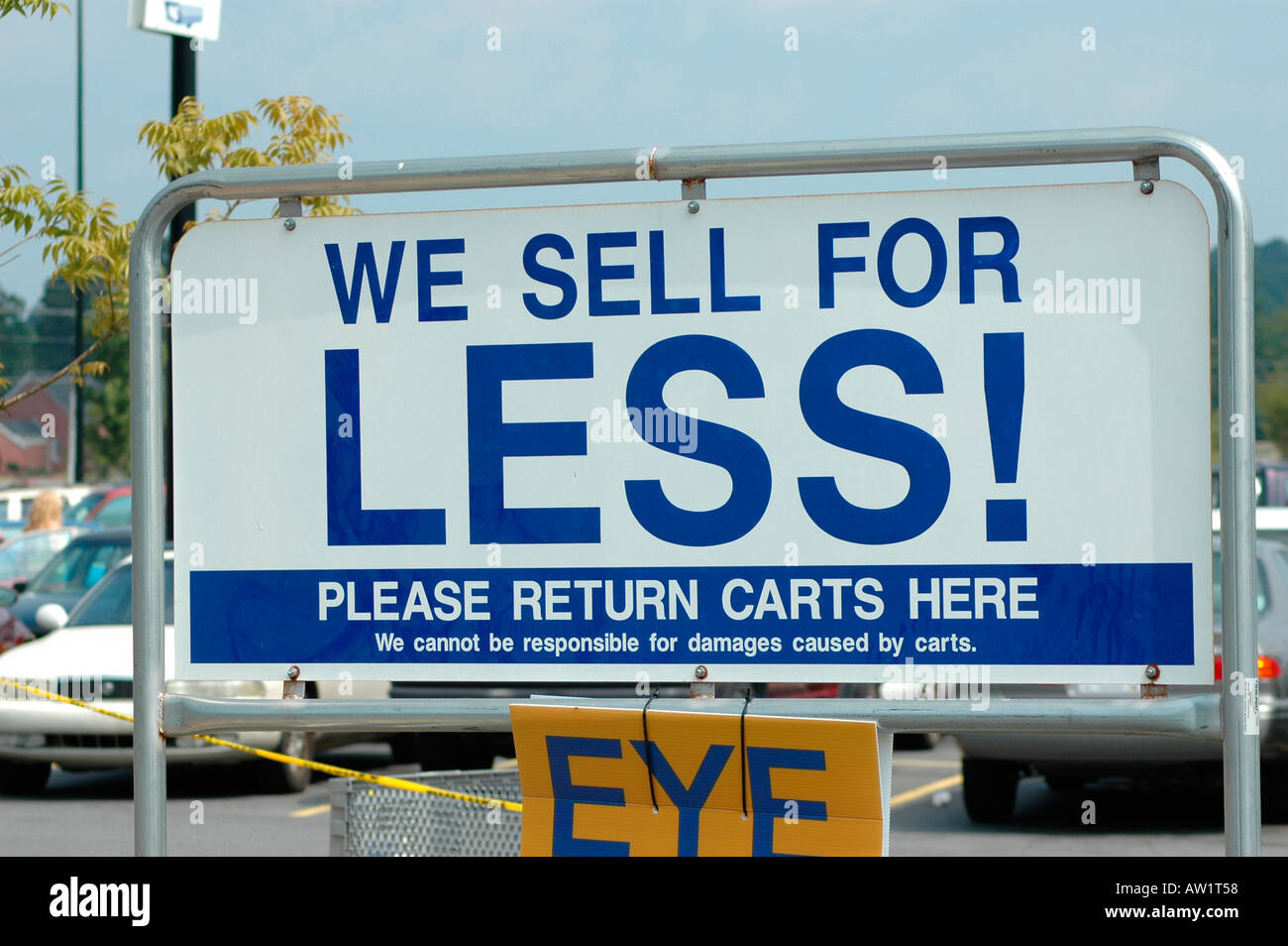 We sell for less and Eye Exam sign at Walmart stores sign shooting USA