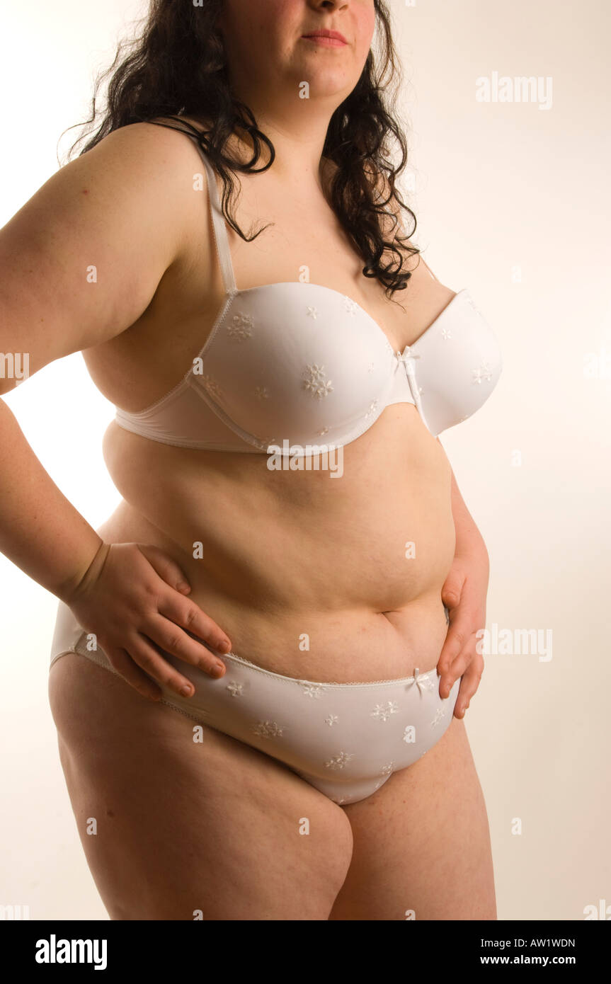 A large big fat overweight obese young woman in her white