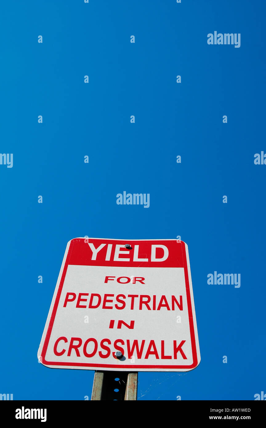 Yield for Pedestrians in Crosswalk sign on road Stock Photo