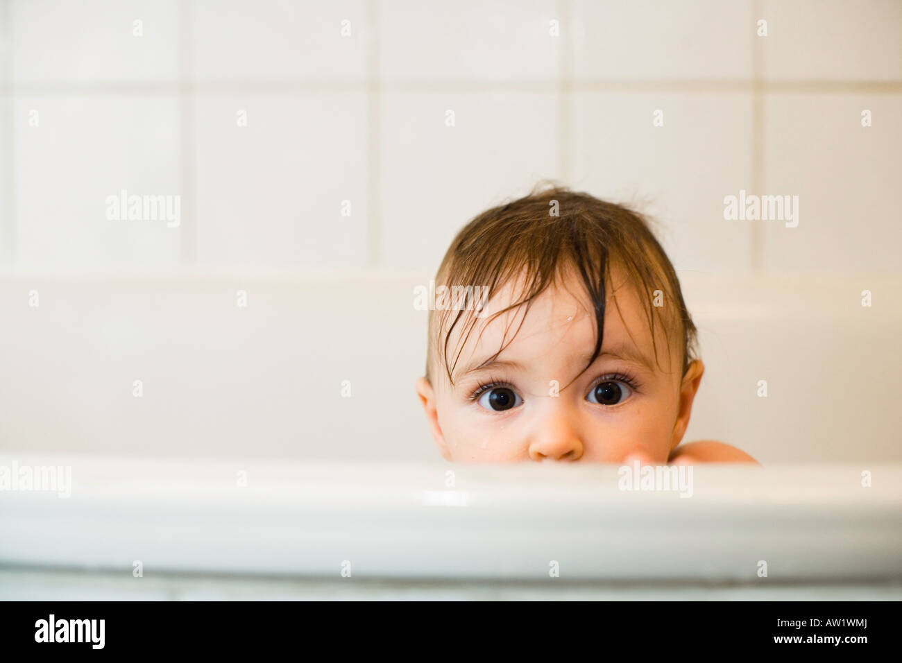 9 month old baby girl in the bath Stock Photo Alamy