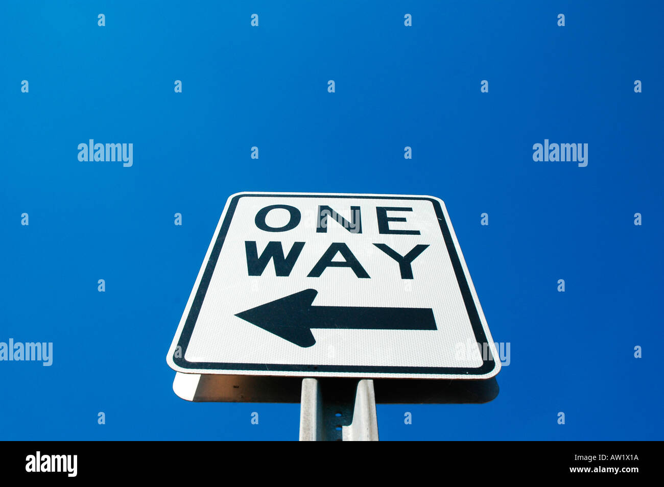 One Way traffic flow arrow, the only way sign on road with arrow pointing left, in America, California, USA Stock Photo