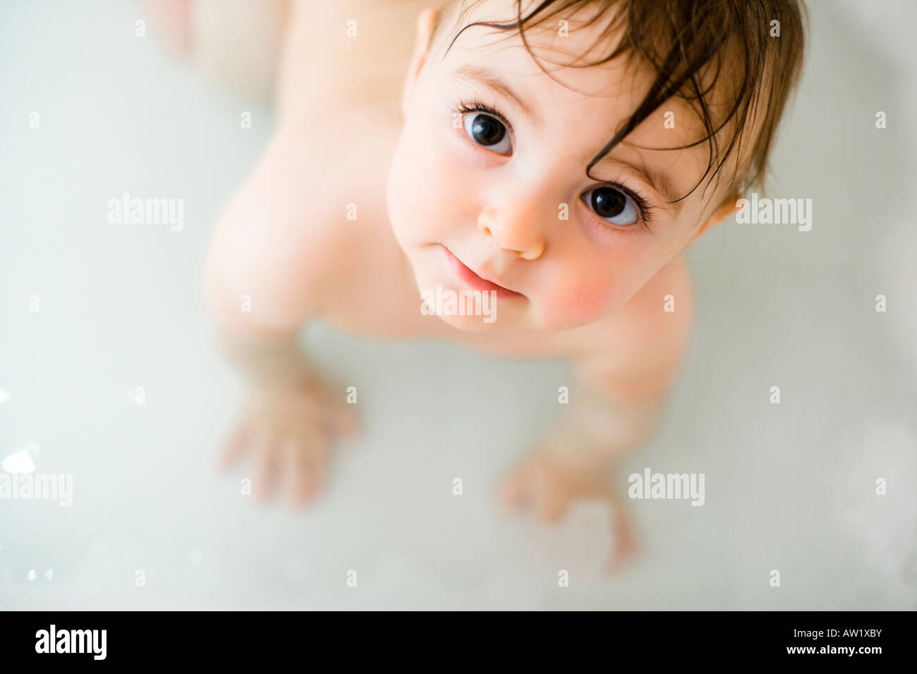 9 month old baby girl in the bath Stock Photo Alamy