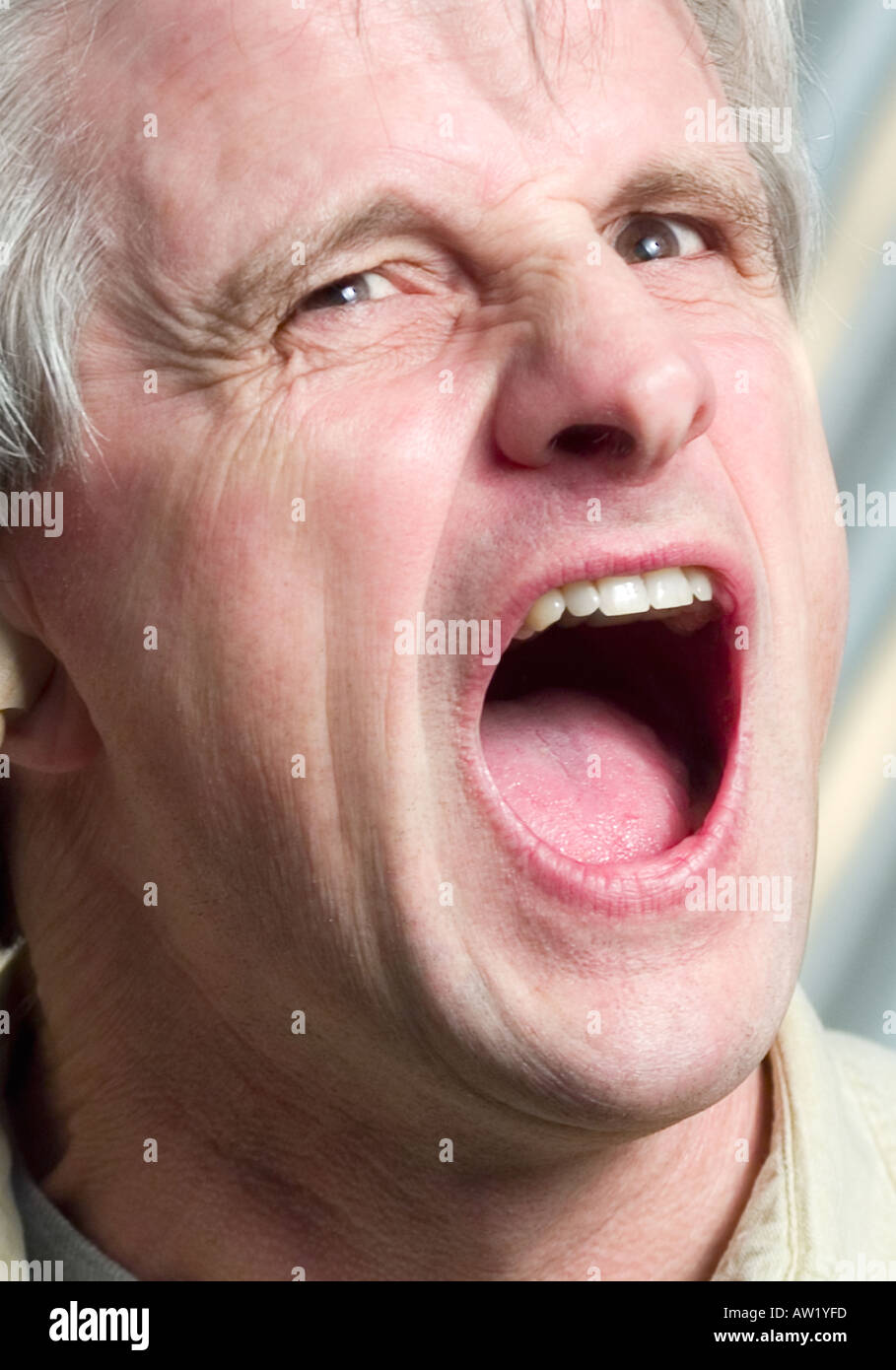 Portrait of Caucasian man shouting Stock Photo