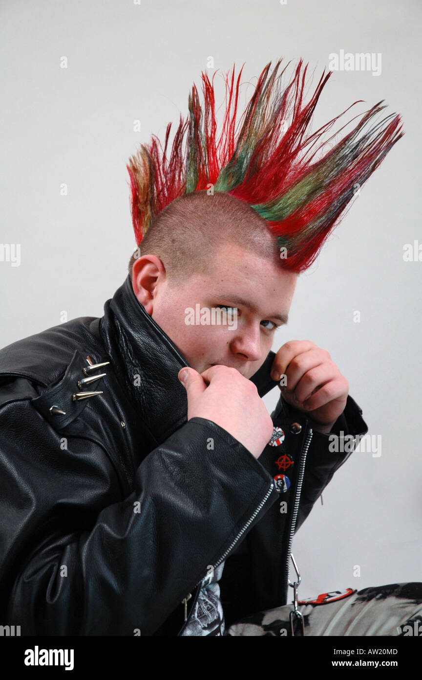 Punk with red and green colored hair Stock Photo
