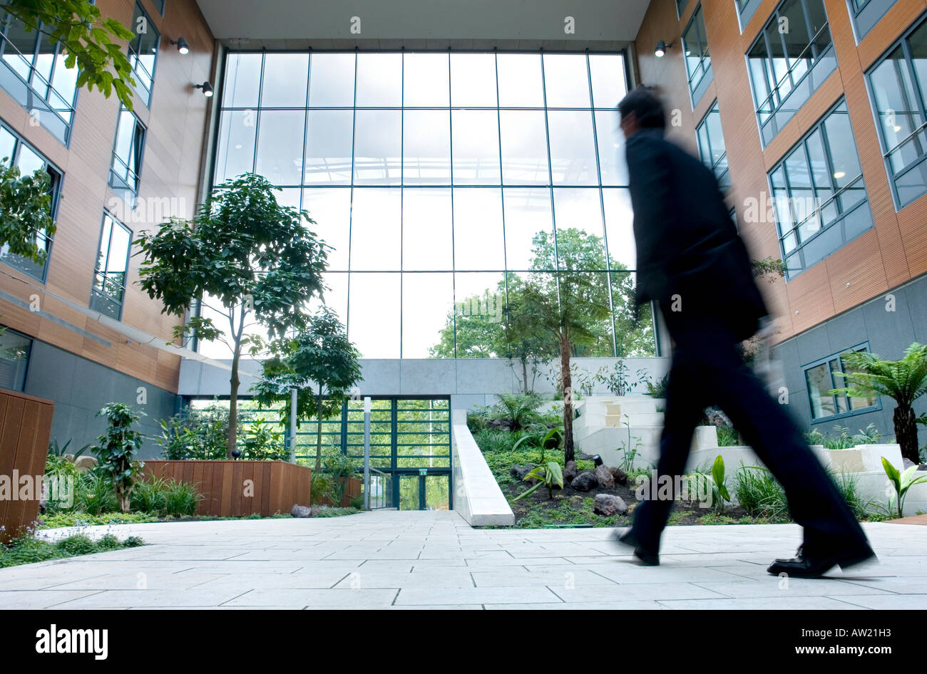 Man walking through an inner court Stock Photo