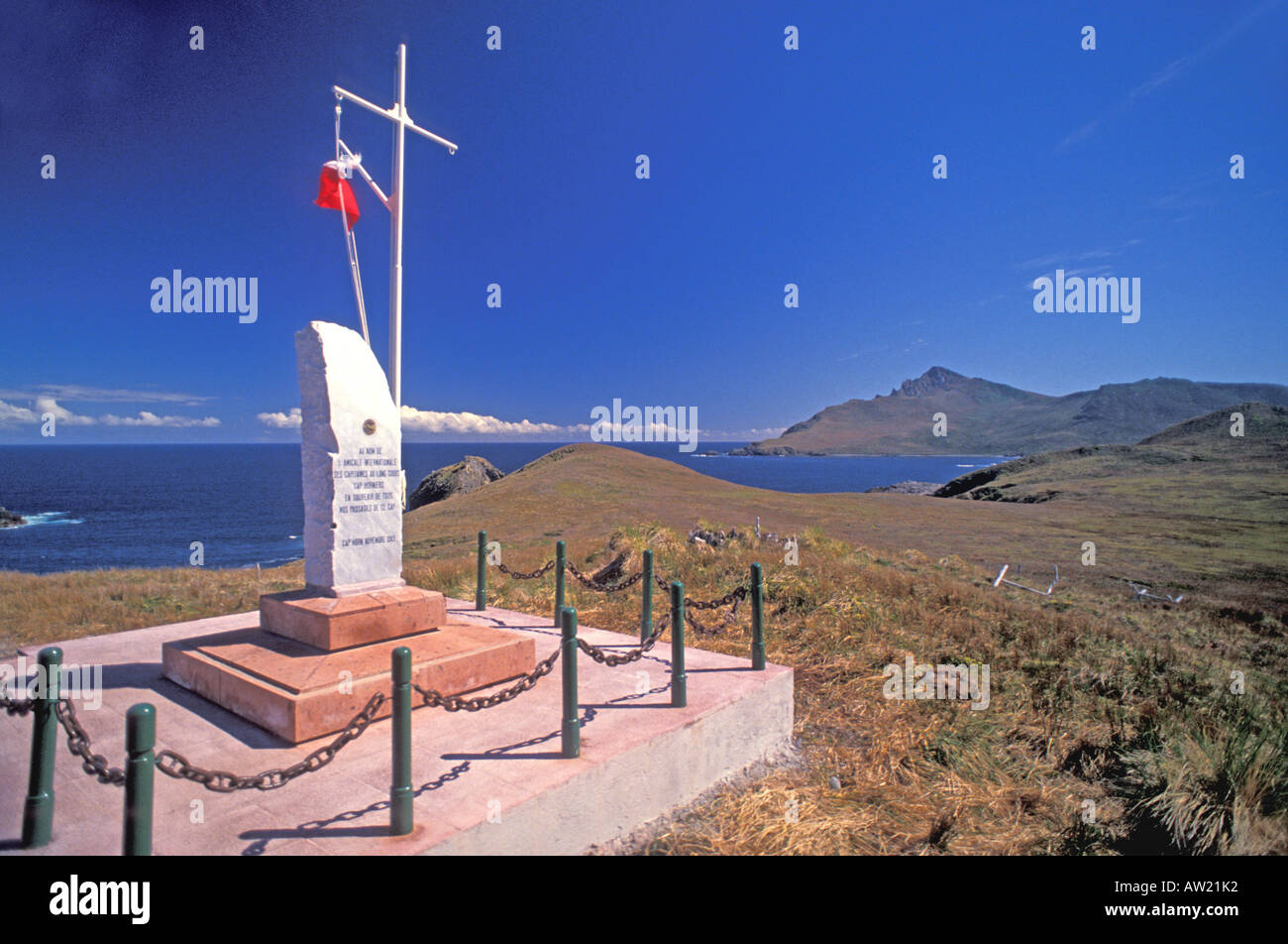 Chile Cape Horn National Park stone marker with panoramic view of the area mountain peaks pacific ocean Stock Photo