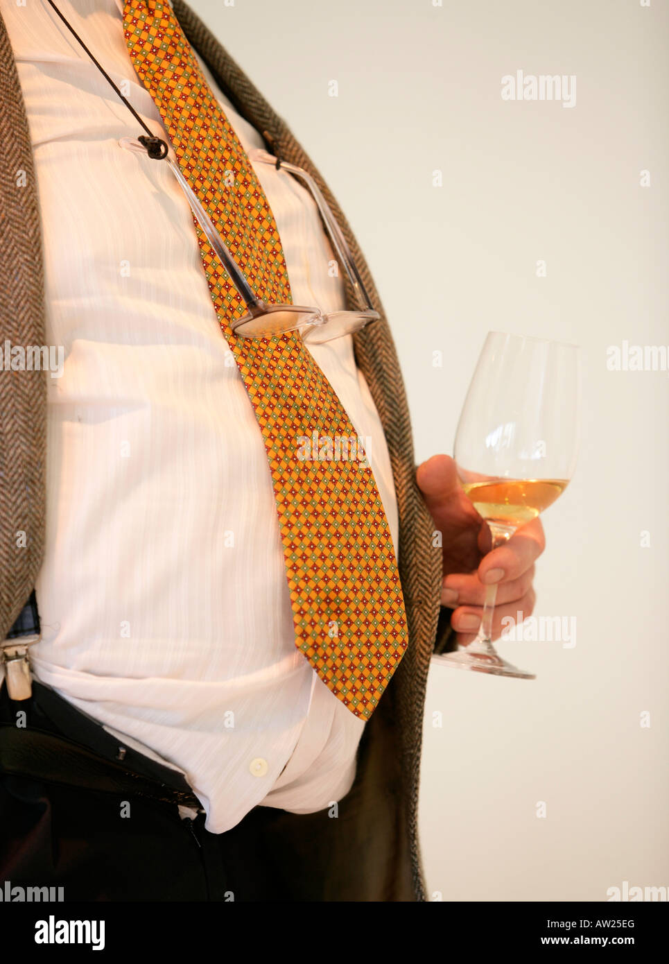 Scruffy man drinking white wine Stock Photo