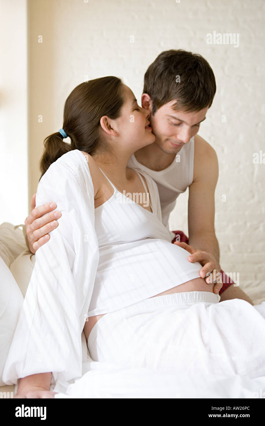Man touching pregnant partners stomach Stock Photo Alamy