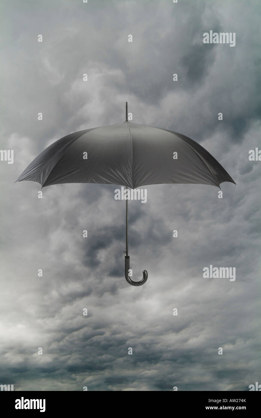 Umbrella With Rain Storm Clouds In Bad Weather Stock Photo