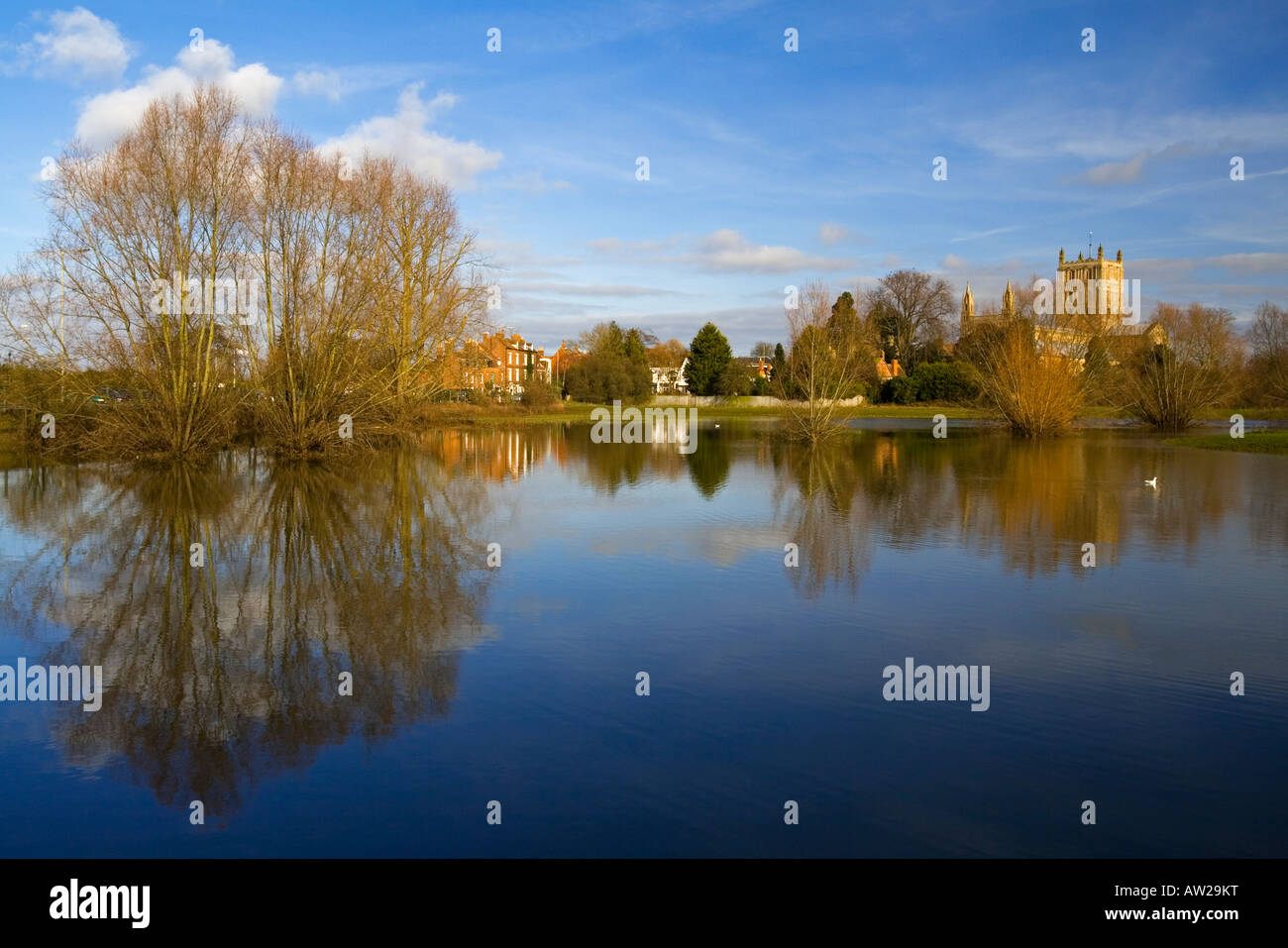 Tewkesbury Abbey St Mary the Virgin Church Gloucestershire England UK with tower reflected in flood water in foreground Stock Photo
