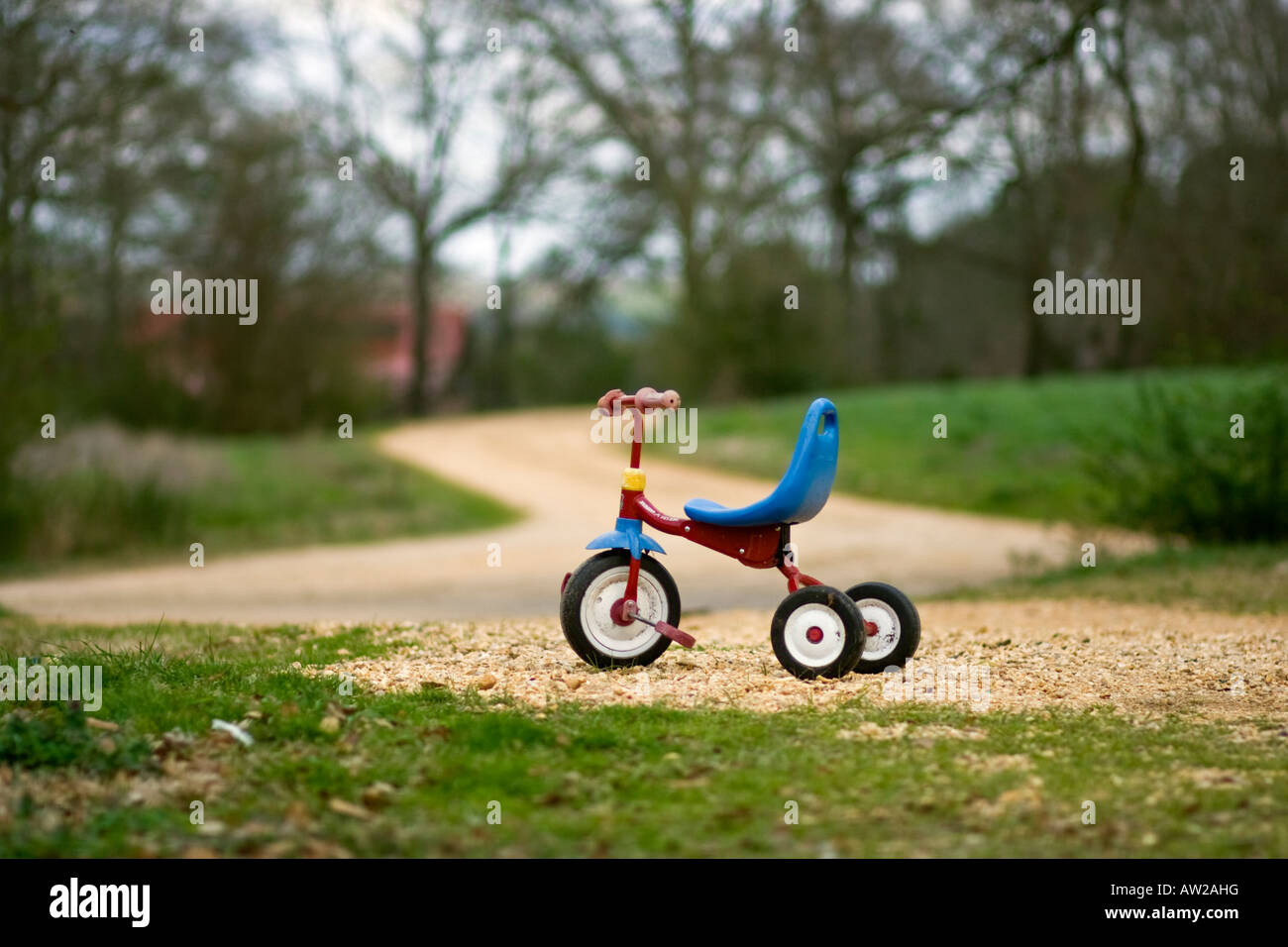 Tricycle in a driveway Stock Photo Alamy