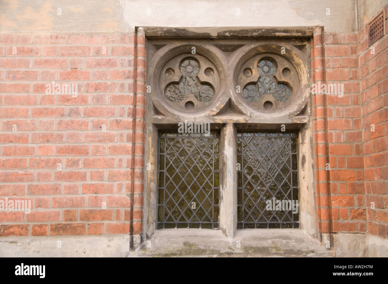 Old leaded windows with carved masonry Stock Photo