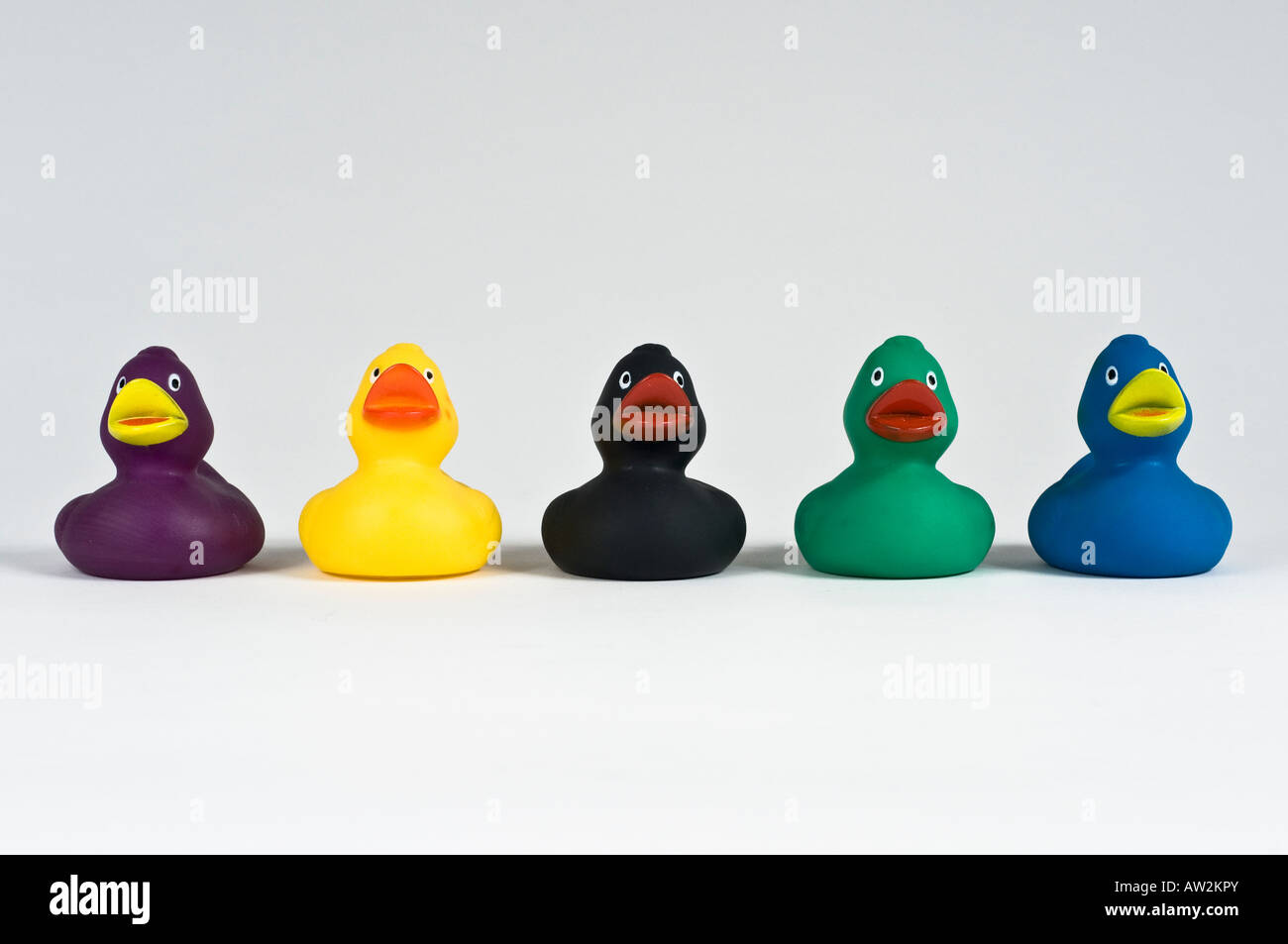 Five Plastic Colored Ducks Blue Green Black Yellow Purple In A Row Stock Photo Alamy